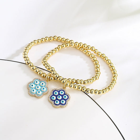 Halo Flower Pendant Golden Bead Bracelet