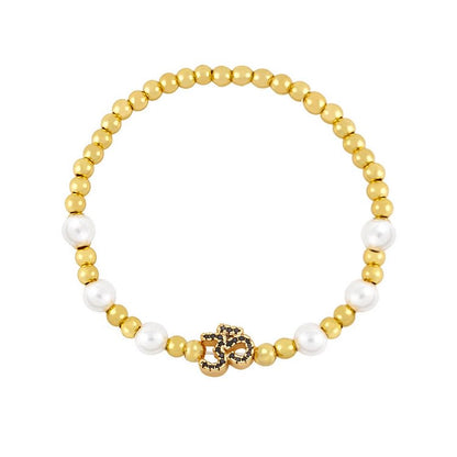 Brass Pearl Beaded Om Symbol Bracelet