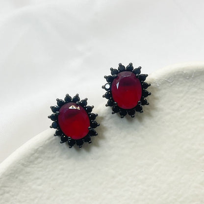 Black Flower Shape Inlaid Red Zircon Earrings