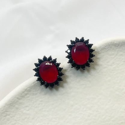 Black Flower Shape Inlaid Red Zircon Earrings