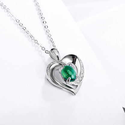 Sterling Silver Channel Setting Hollow Heart Shape Pendant with Oval Brilliant Cut Emerald Gem