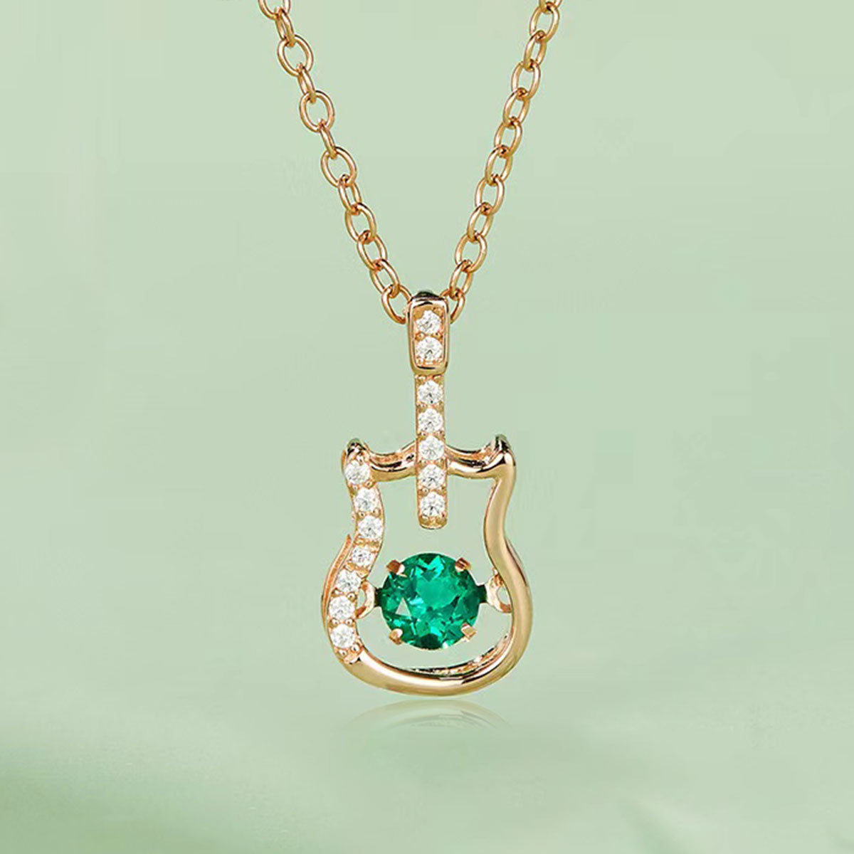 Rose Gold Guitar Shape Beating Emerald Chain