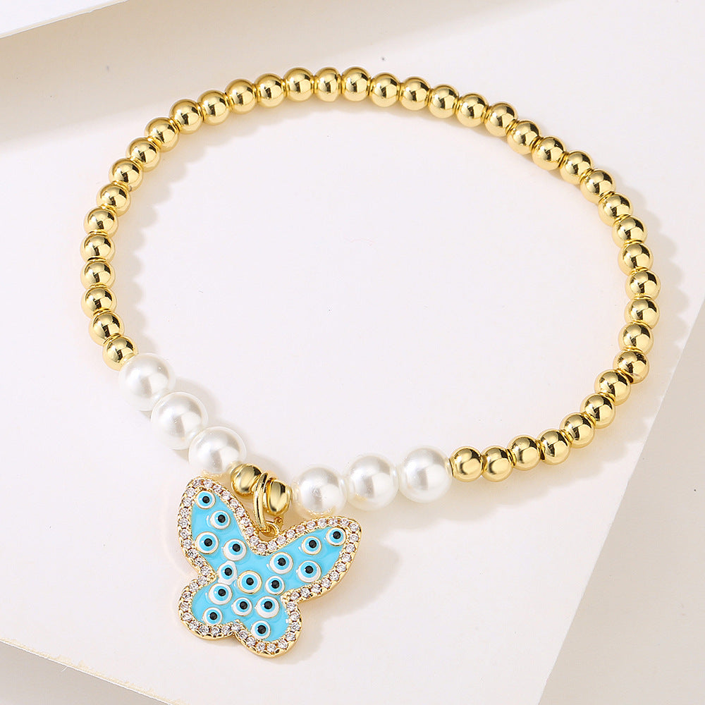 Halo Butterfly Pendant Golden Bead Bracelet