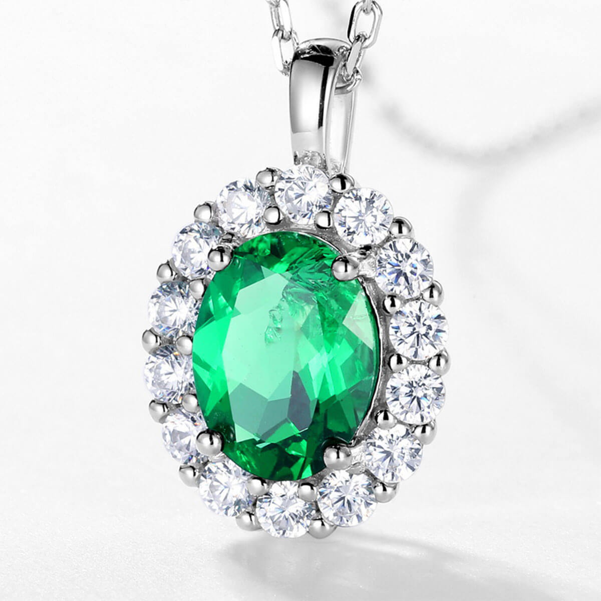 White Gold Oval Cut Emerald Halo Pendant Chain